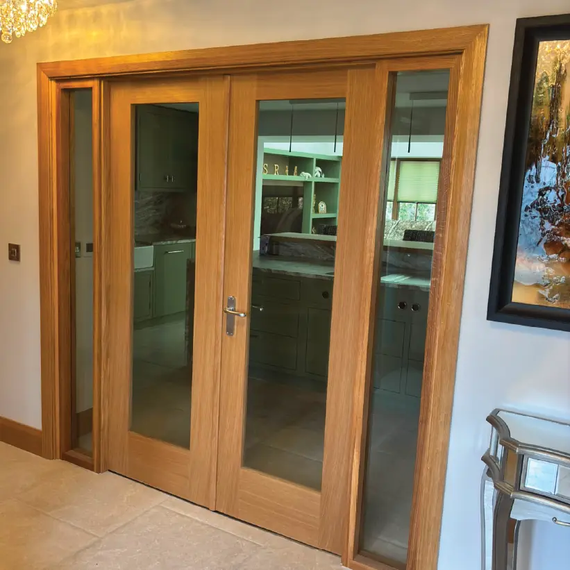 Oak glazed double doors between the hall and the kitchen