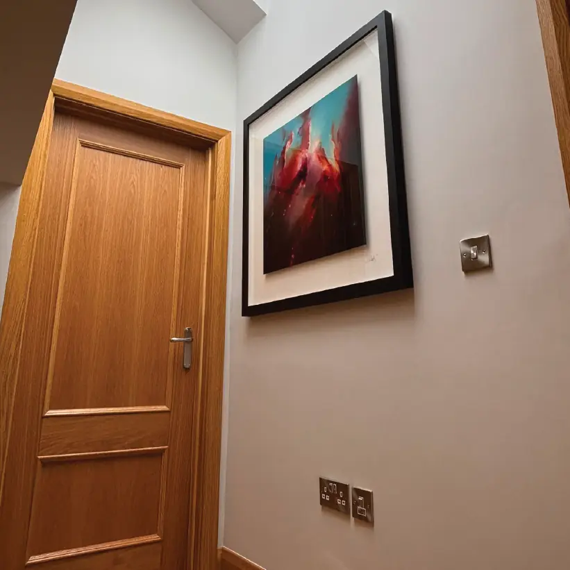 Oak panelled internal door and architrave in a remodelled hallway