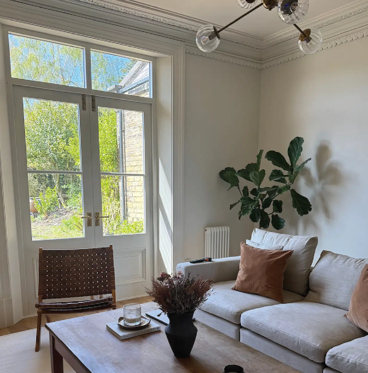 Drawing room with restored full-height sash doors opening to the garden